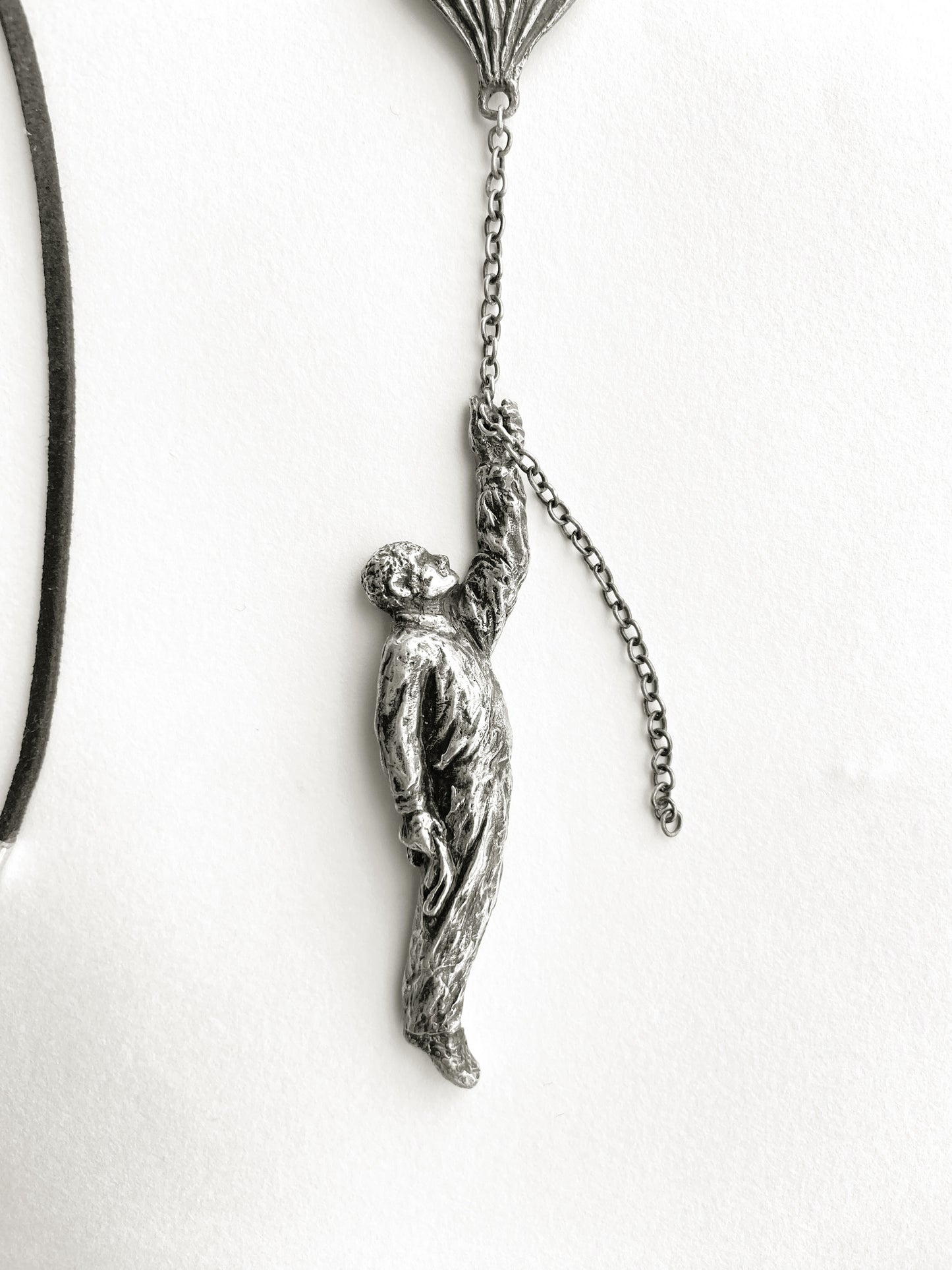 Pendant: Man, dachshund, balloon